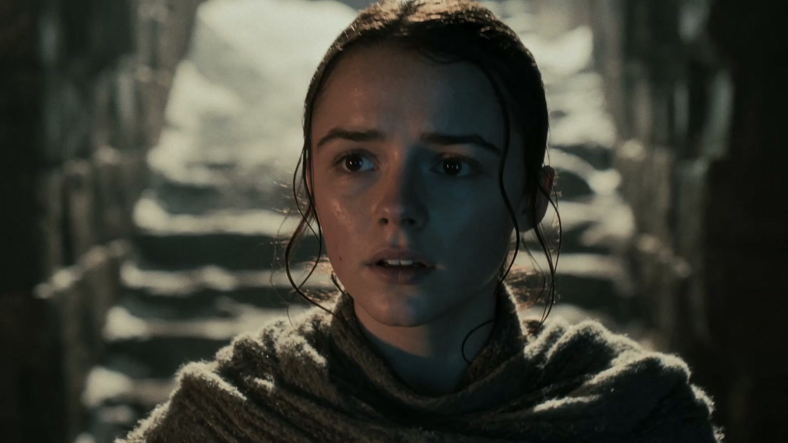 A young woman in a weathered historical setting